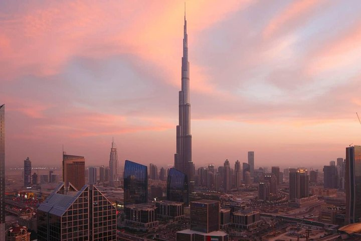Experience Dubai's stunning skyline at sunset showcasing iconic landmarks like Burj Khalifa. Ideal for immersing in the city's rich history and modern marvels on your half-day adventure.